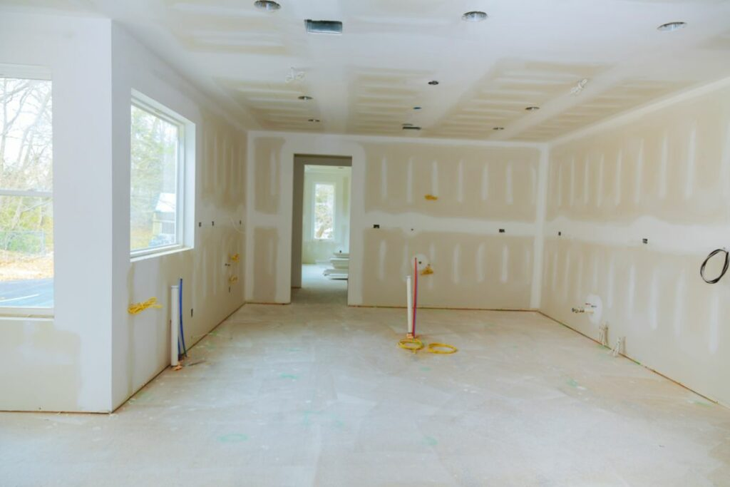 image - Brawler Drywall Skilled drywall installation process showing precise joint alignment. | Brawler Drywall
